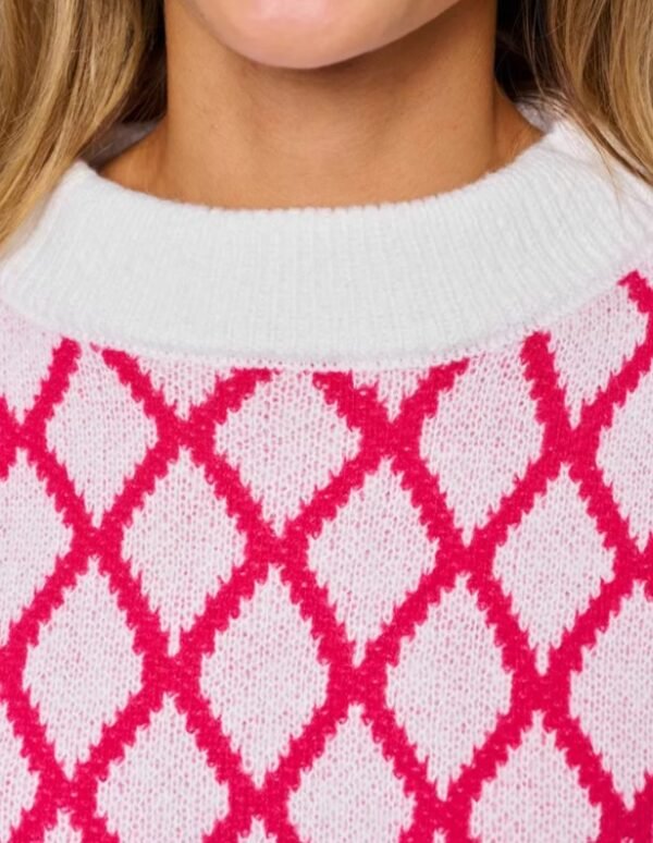 the collar of pink and white sweater