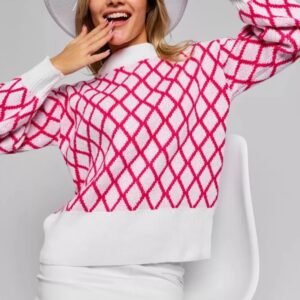 smiling woman wearing pink and white sweater and white skirt