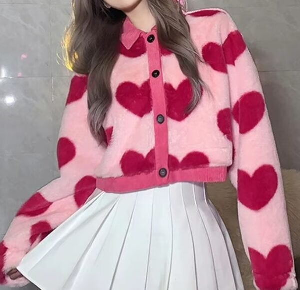 woman wearing pink cardigan with hearts