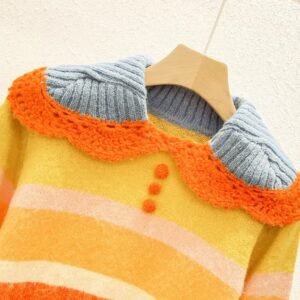 the collar of the cute orange sweater on a hanger