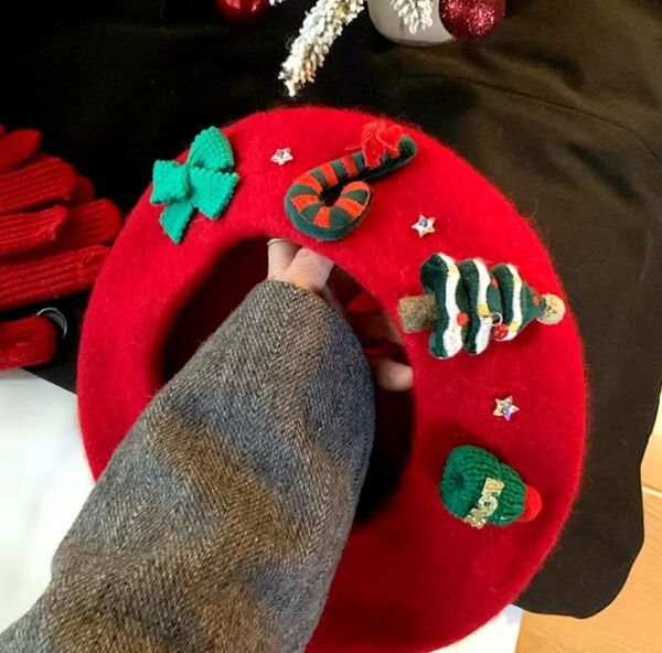 woman holding Christmas beret