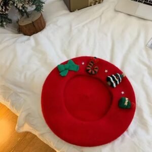 Christmas beret, red variation, lying on the white bed, a Christmas tree and a retro radio next to it