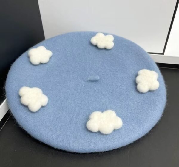 cloudy colorful beret on the dark grey table