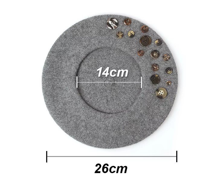 the measurements of colorful beret with buttons on the white background 