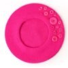 fuchsia colorful beret with buttons on the white background