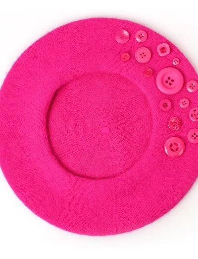 fuchsia colorful beret with buttons on the white background