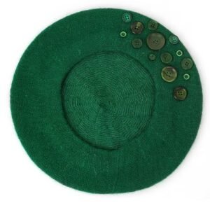 green colorful beret with buttons on the white background