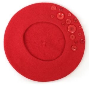 red colorful beret with buttons on the white background