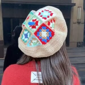 woman wearing white colorful crochet beret exposing its back side