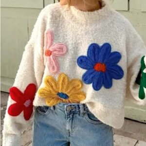 woman wearing colorful floral sweater