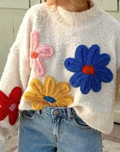 woman wearing colorful floral sweater