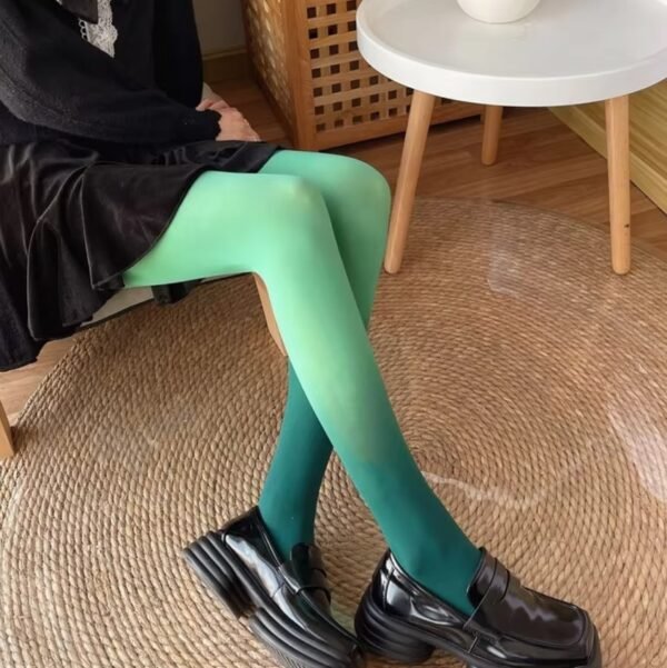 woman sitting in green colorful gradient tights