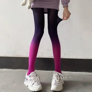 woman wearing purple colorful gradient tights and white sneakers, grey wall behind her