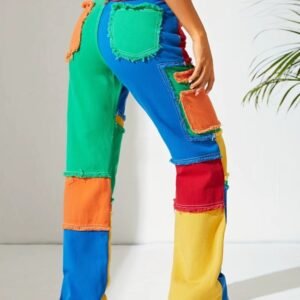 woman posing in colorful jeans exposing their back pockets