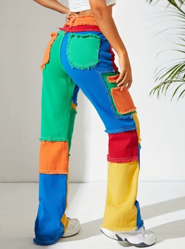 woman posing in colorful jeans exposing their back pockets