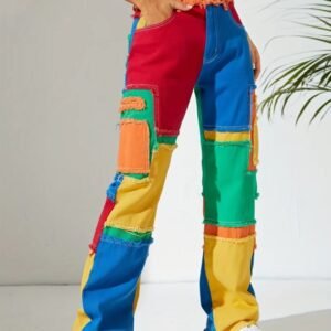 woman standing in colorful jeans in the white room