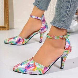 woman standing in colorful pattern heels exposing their side