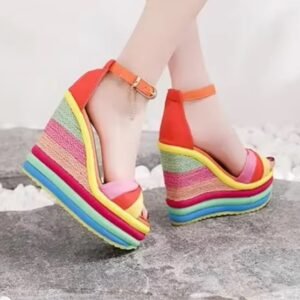 woman wearing colorful striped wedges