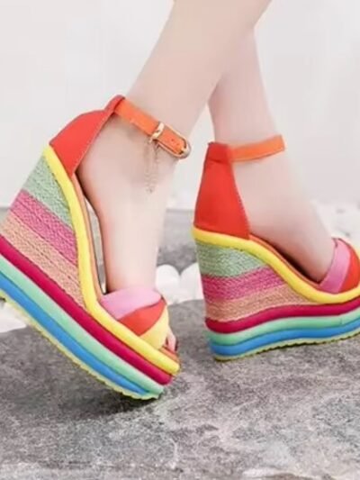 woman wearing colorful striped wedges