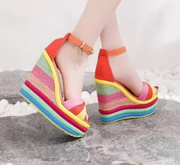 woman wearing colorful striped wedges