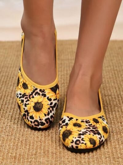 woman wearing colorful sunflower flats
