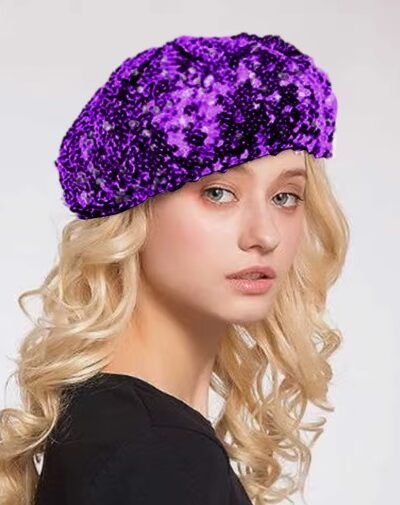 woman wearing purple disco colorful beret, white wall behind her