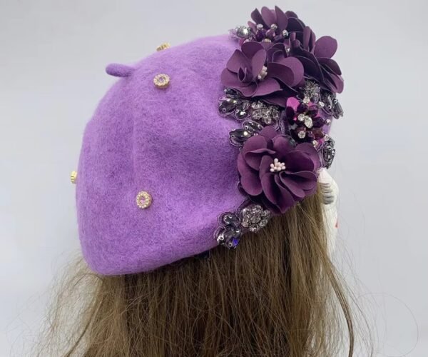 purple fancy colorful beret on a mannequin