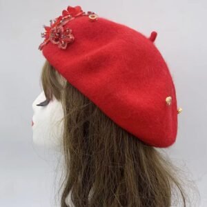 the side view of red fancy colorful beret on a mannequin