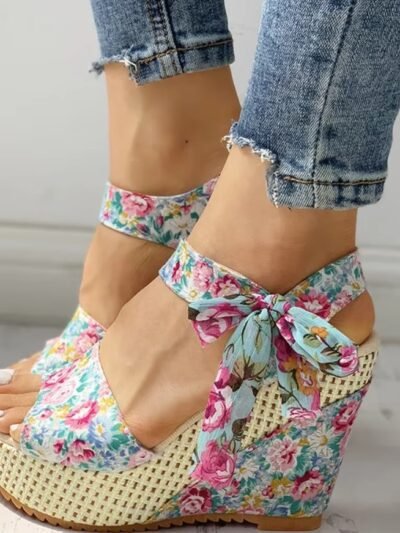 woman wearing floral wedges