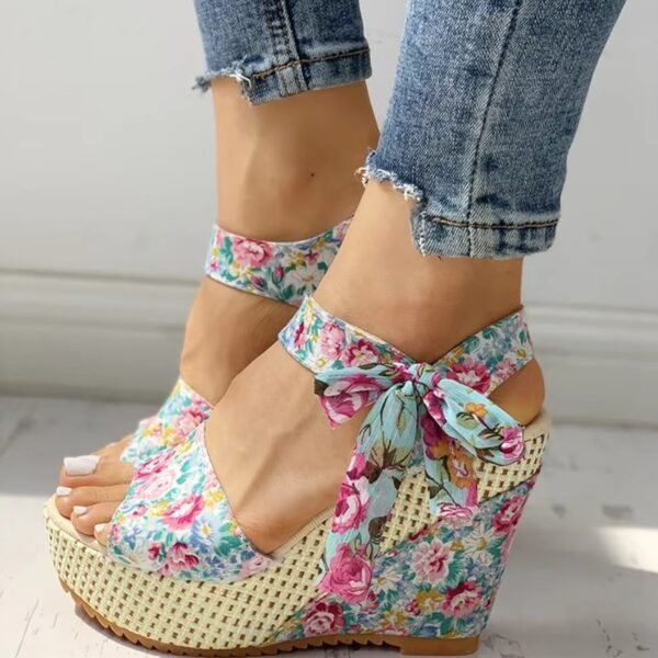 woman wearing floral wedges