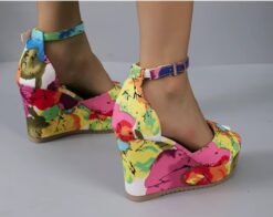 woman wearing multicolor wedges and exposing their backside