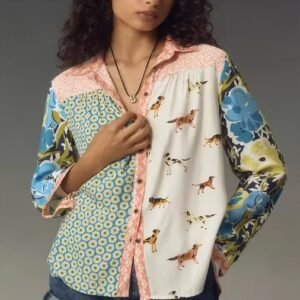 woman with brown curly hair wearing 90s colorful blouse