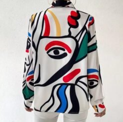 back side of artistic colorful blouse on the white background