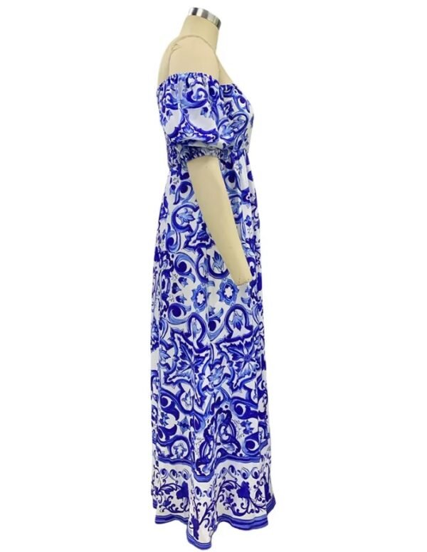 side view of blue colorful bohemian dress on a mannequin, white background