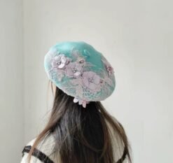 woman wearing blue colorful lace beret