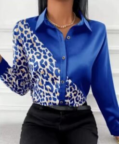 woman wearing blue leopard print colorful blouse and black jeans