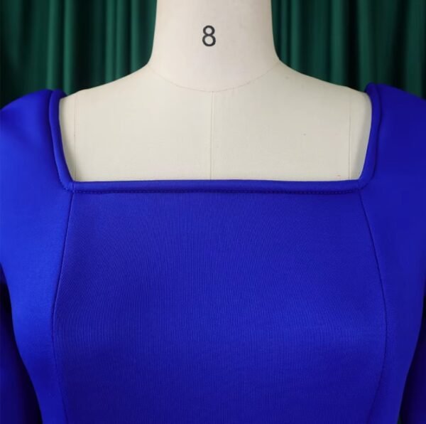 the neckline of blue long-sleeved colorful dress on a mannequin