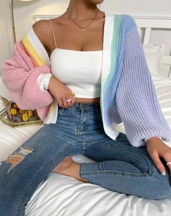 woman wearing casual colorful cardigan, white top and dark jeans