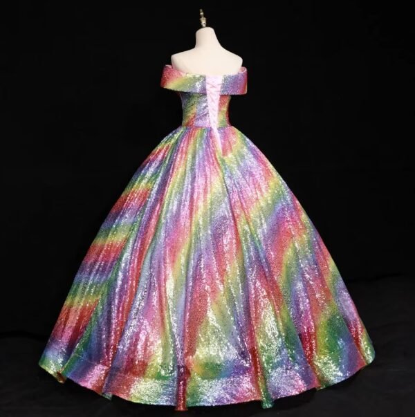 back side of colorful ball gown on a mannequin, black background