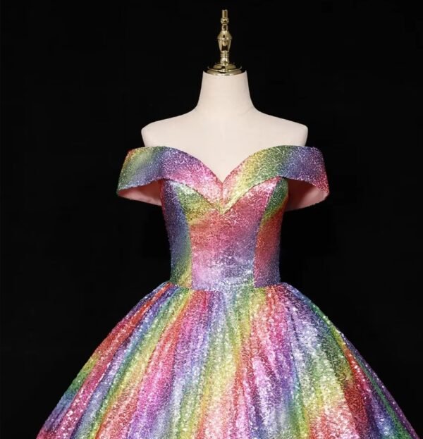 upper part of colorful ball gown on a mannequin, black background