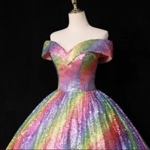 waistline and upper part of colorful ball gown on the black background