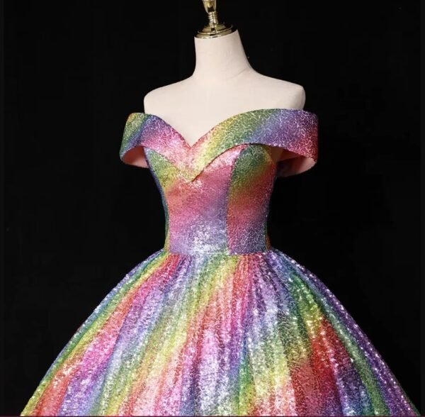 waistline and upper part of colorful ball gown on the black background