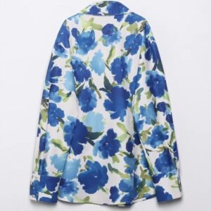 back view of colorful blouse with blue flowers on the white background