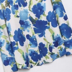 the bottom part of colorful blouse with blue flowers