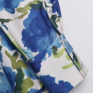 material and sleeve of colorful blouse with blue flowers