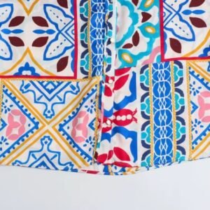 bottom part of colorful boho blouse on the white background