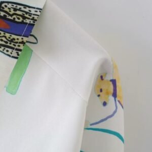 shoulder part of colorful characters blouse on the white background