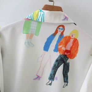 back view of upper part of colorful characters blouse on a hanger