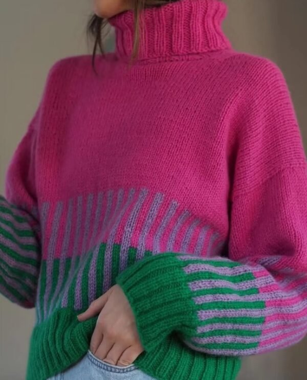 woman turned to her side wearing colorful color blocking sweater