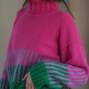 woman wearing colorful color blocking sweater and jeans